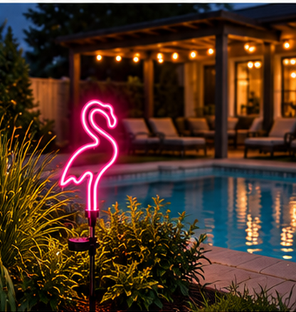 Decasa neon flamingo solar garden light beside a pool